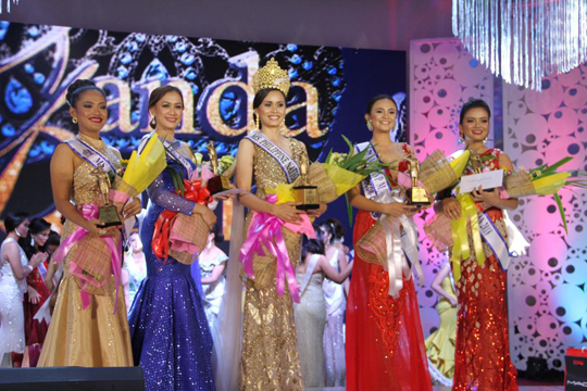 COP ON HIGH HEELS. Police Officer 1 Madonna Gay C. Cajocon (center) smiles at the crowd after bagging the Ms. PNP Ganda Pulis 2018 crown.  Photo PO2 Jhuryco Jabonete