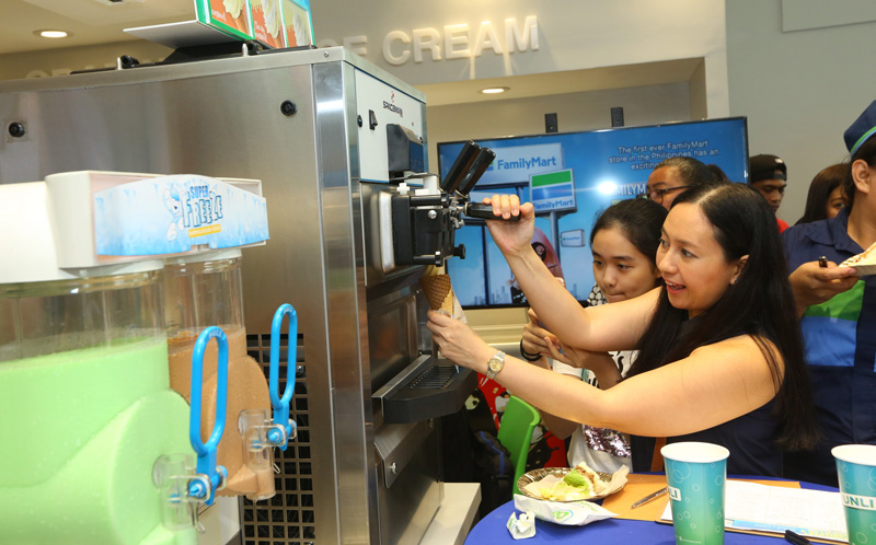 Customers grab a serving of FamilyMart’s new Twirl-All-You-Can flavor, Kesong Puti Sansrival.