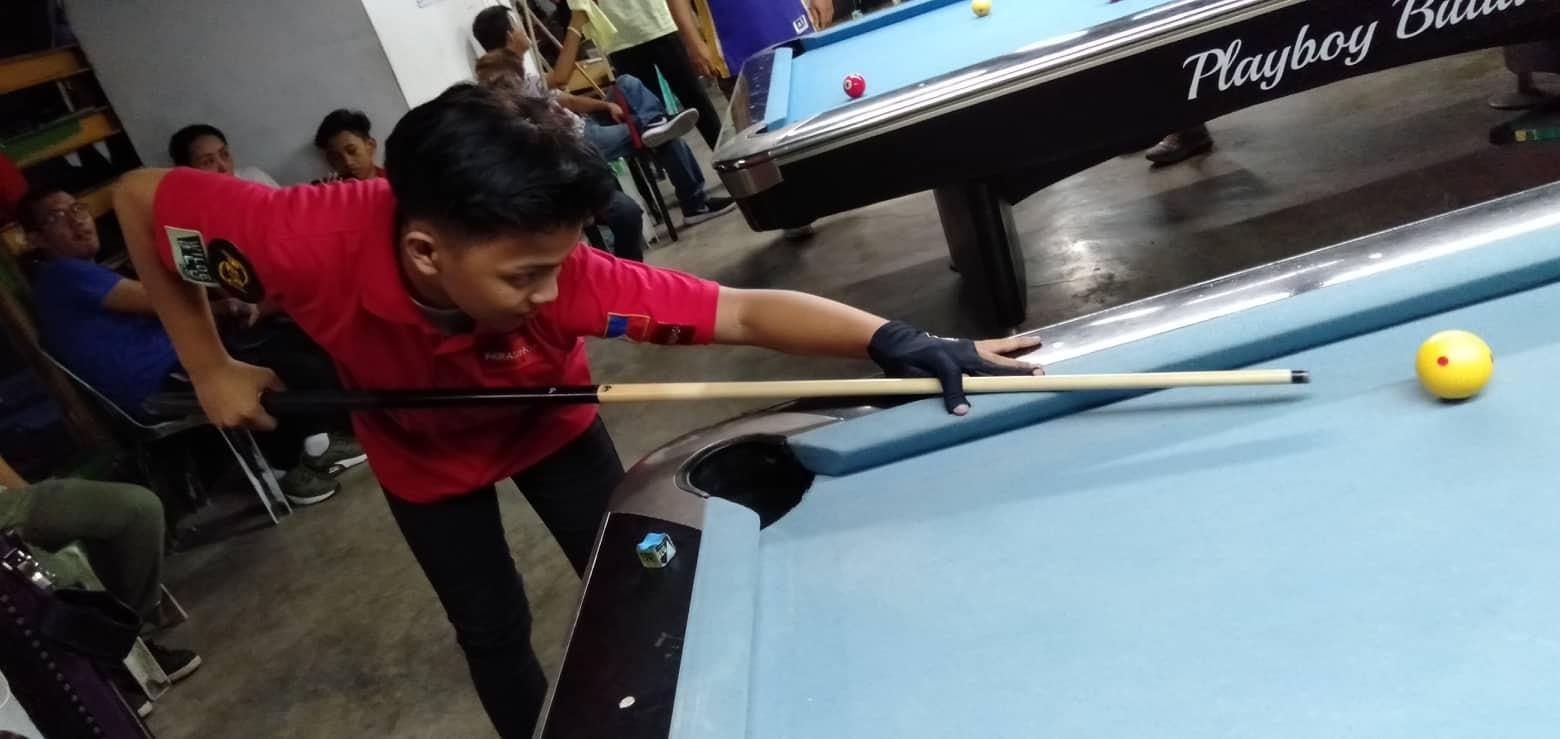 Photo shows PH young cue artist Bernie Regalario in his winning form against Paul Kenneth Arpilleda during the finals of the Wilde Blu 9-ball and 10-ball WTA Challenge