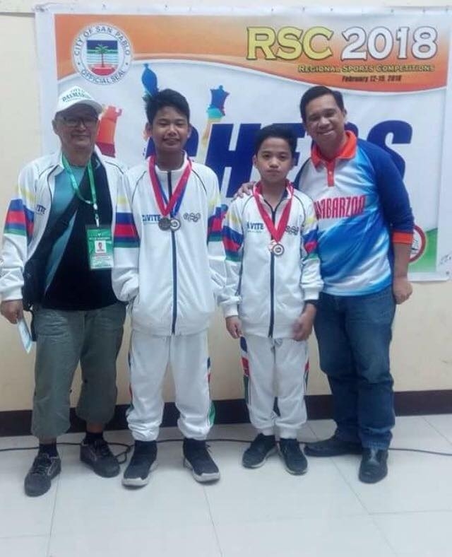 Photo shows Daniel Quizon, 13-years-old (3rd from left) and Michael Concio Jr., 12-years-old, (2nd from left) both Fide Master elect, both representing Dasmarinas, Cavite high school chess team backed up by Dasmarinas mayor Elpidio "Pidi "Barzaga Jr. and congresswoman Jenny Barzaga bagged the gold medal and championships trophy in the just ended 2018 Southern Tagalog Calabarzon Athletic Association (STCAA) Meet on Wednesday (February 14, 2018) at the Laguna State Polytechnic University ( San Pablo campus) in San Pablo, Laguna.
