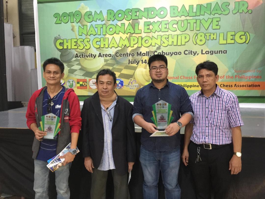 Photo shows from L-R: Victor Anas (2nd place), Philippine Executive Chess Association president Dr. Jenny Mayor, Recarte Tiauson (champion) and tournament director Dr. Alfred Paez during the closing rites of the  8th leg National Executive Chess Championship dubbed as 2019 Grandmaster Rosendo Balinas Sr. Chess Cup held here at the Activity Area, Centro Mall, Cabuyao City, Laguna on Sunday.