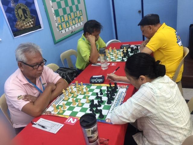 Photo shows Sydney, Australia-based Edgar "Bote" Bautista versus 1996 Yerevan, Armenia World Chess Olympiad member and Woman Candidate Master (WCM) Imelda Flores and Vic Alfaro versus National Master (NM) Efren Bagamasbad in Round 5 of the on-going 2019 National Seniors Chess Championship (Standard competition) at the Philippine Academy for Chess Excellence (PACE) No. 56 Mindanao Avenue in Project 6, Quezon City on Wednesday.