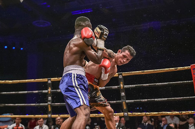 Filipino IBO World Champ Michael “Gloves on Fire” Dasmarinas in action, as he faced his opponent, Ghana’s Manyo “Black Flash” Plange, at Marina Bay Sands, Saturday night. 