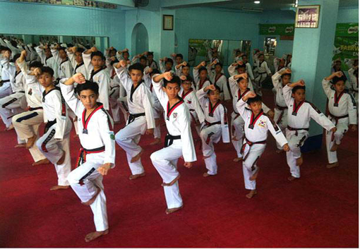 Photo shows summer class participants at the start of their training at the Taekwondo School Center at the Rizal Memorial Sports Complex.